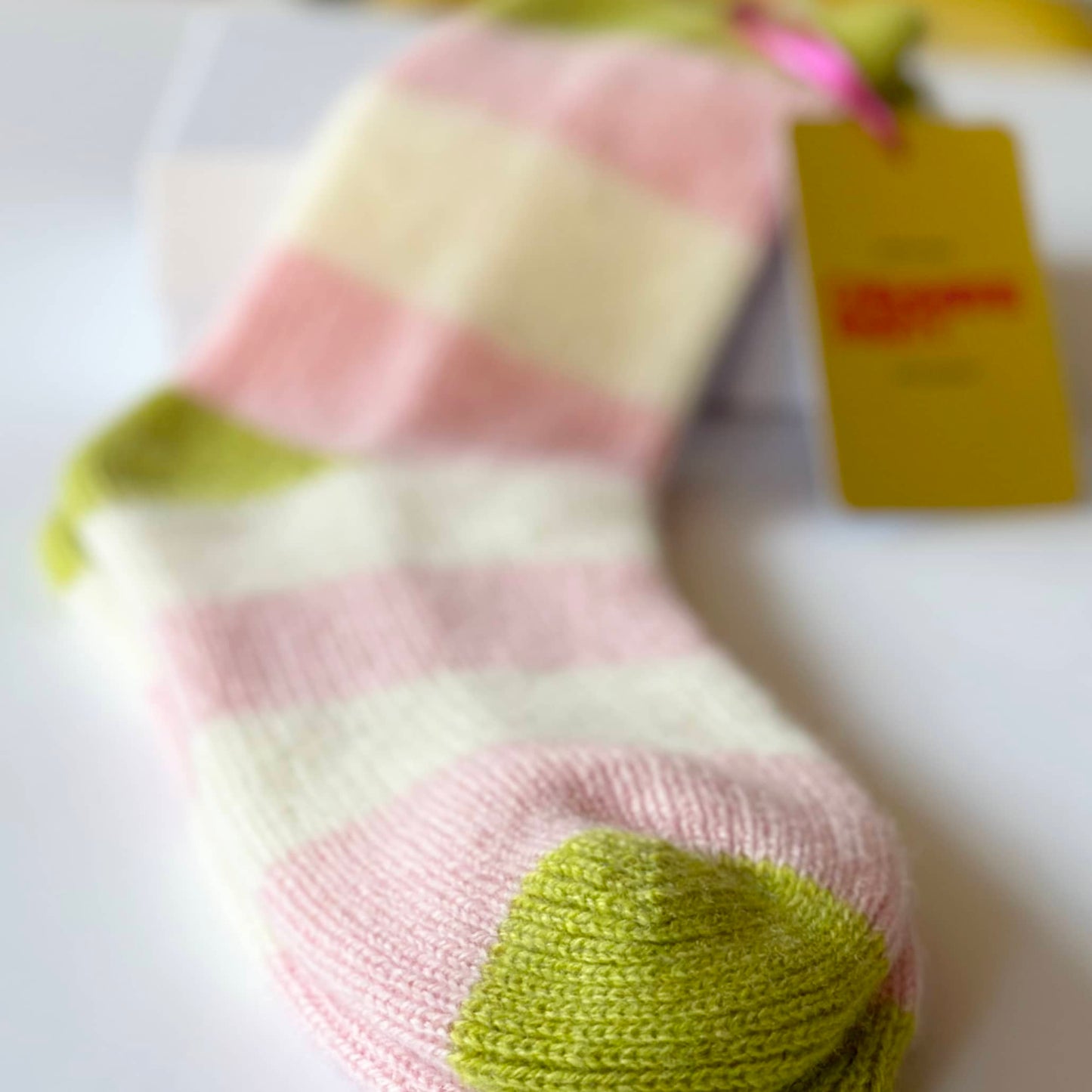 Close up of modern cashmere socks by Cashmere Party. 100% pure cashmere socks with bright stripes. Handmade luxury socks.