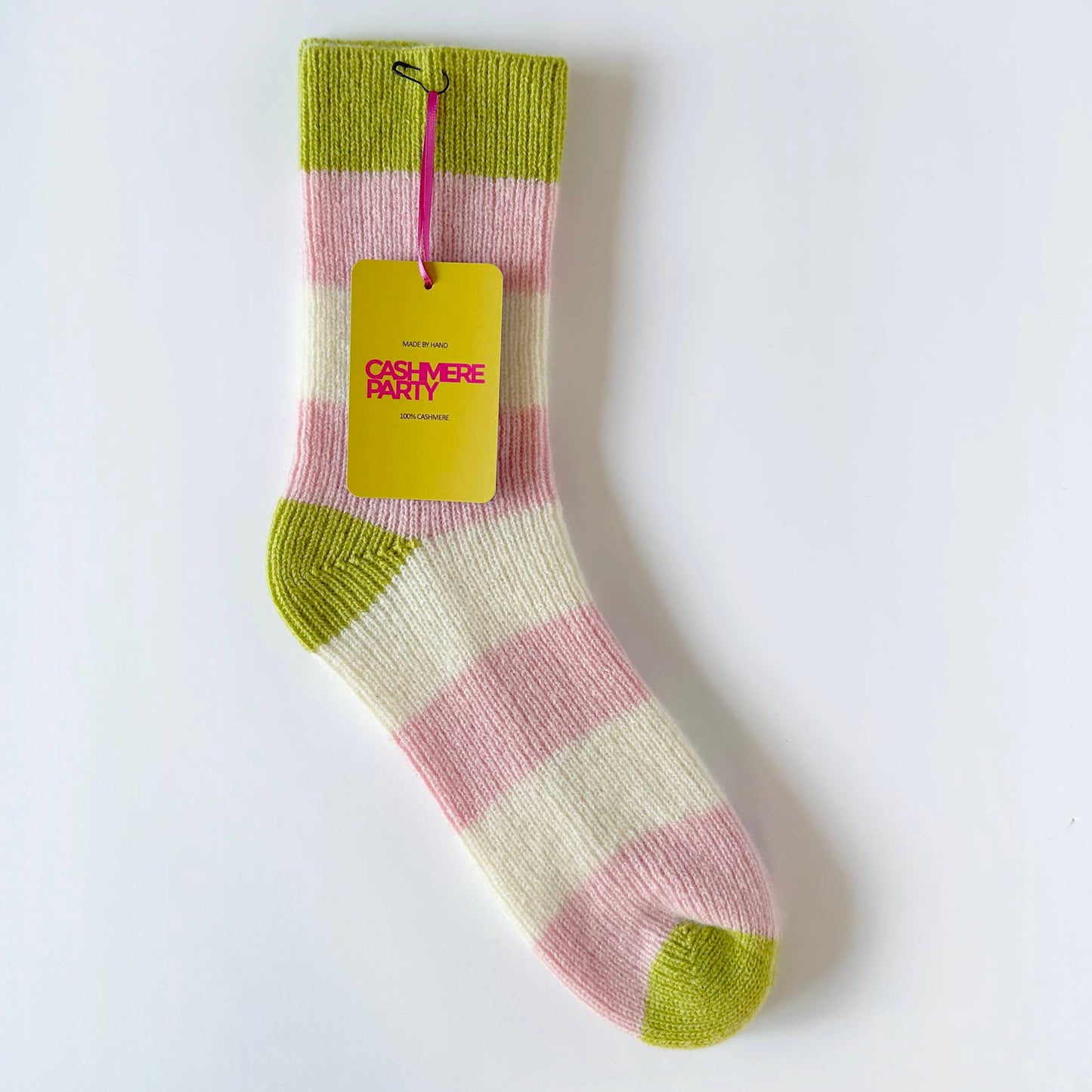 Flat image of 100% pure cashmere socks by Cashmere Party. Handmade modern fun cashmere bed socks with bold chunky stripes in pink and cream and lime. Thick warm luxury cashmere socks.