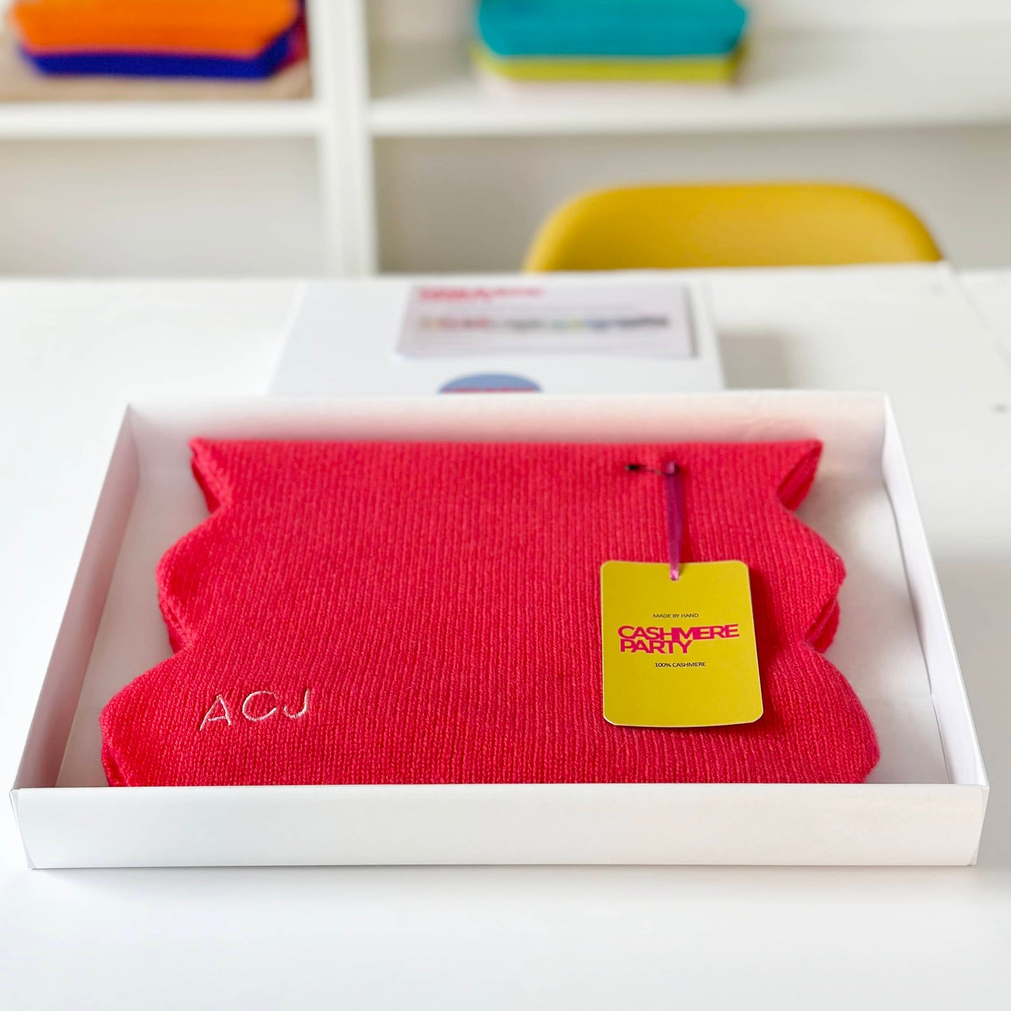 Red cashmere scarf in gift box with swing ticket.  Scallop edge cashmere scarf in red colour.