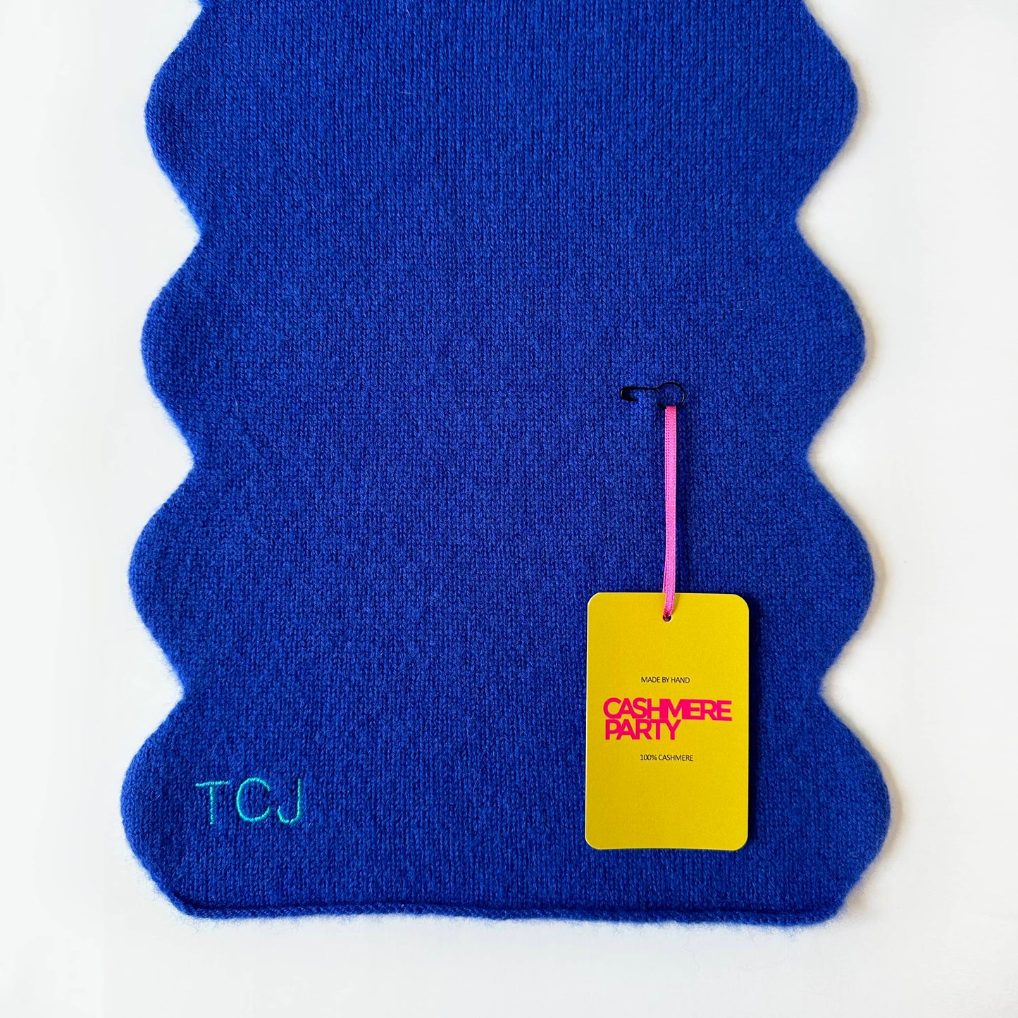 Bright Yves Blue cashmere scarf with scallop wavy edges. Modern cashmere scarf design with branded swing ticket and personalisation.
