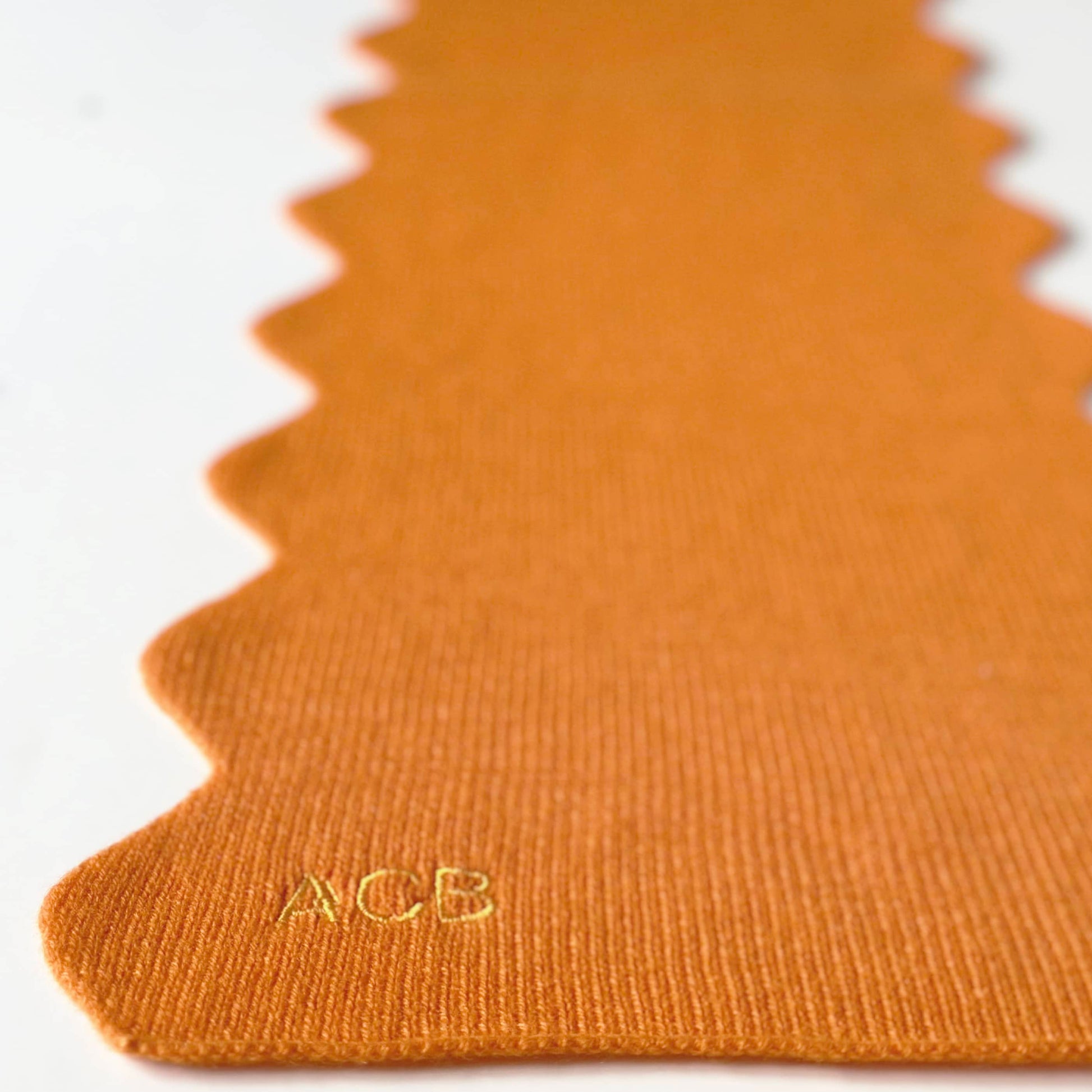 Luxury pure cashmere scarf in orange colour.  With scallop edges and personalised embroidery.  Handmade cashmere scarf.