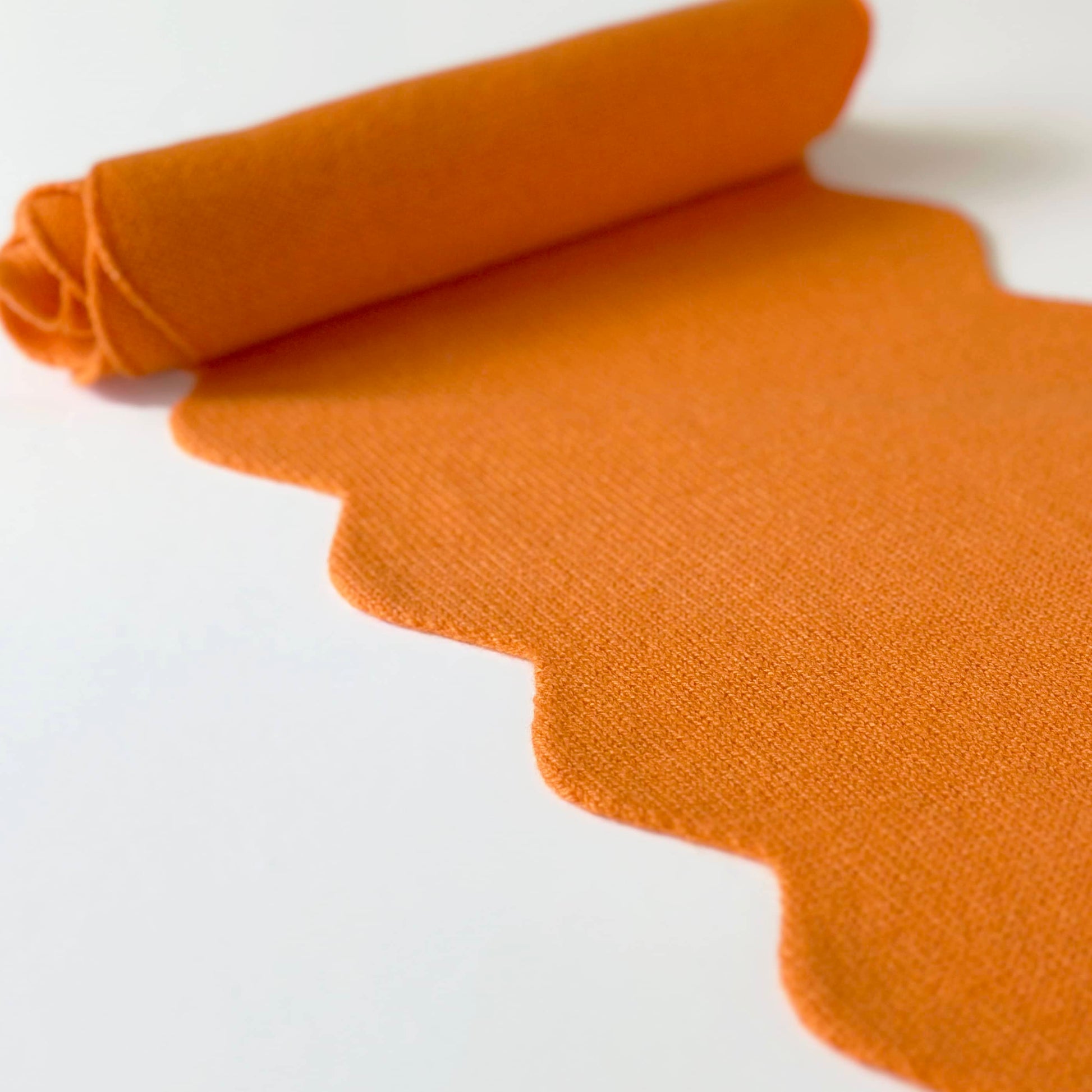 Orange cashmere scarf by Cashmere Party.  With scallop edges.  Modern fun cashmere in bright colours.