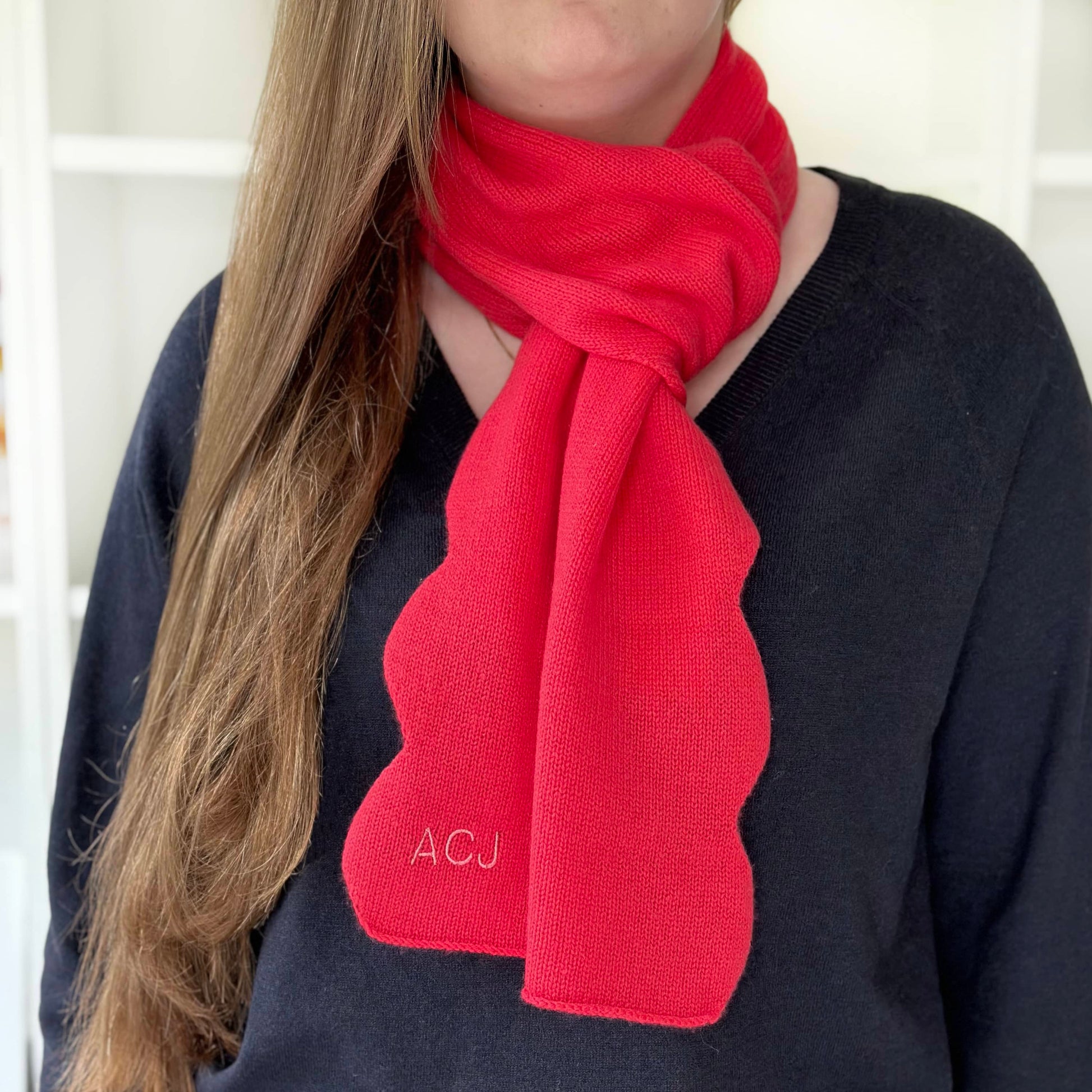 Red cashmere scarf with scallop edge and personalisation.  Handmade knitted cashmere scarf in pure cashmere.  Bold modern cashmere by Cashmere Party.