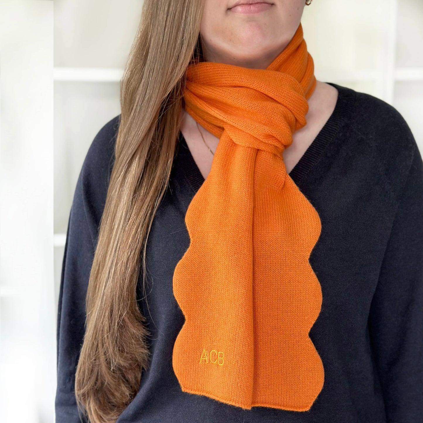 Orange cashmere scarf with scallop edges.  Modern fun cashmere with personalisation.