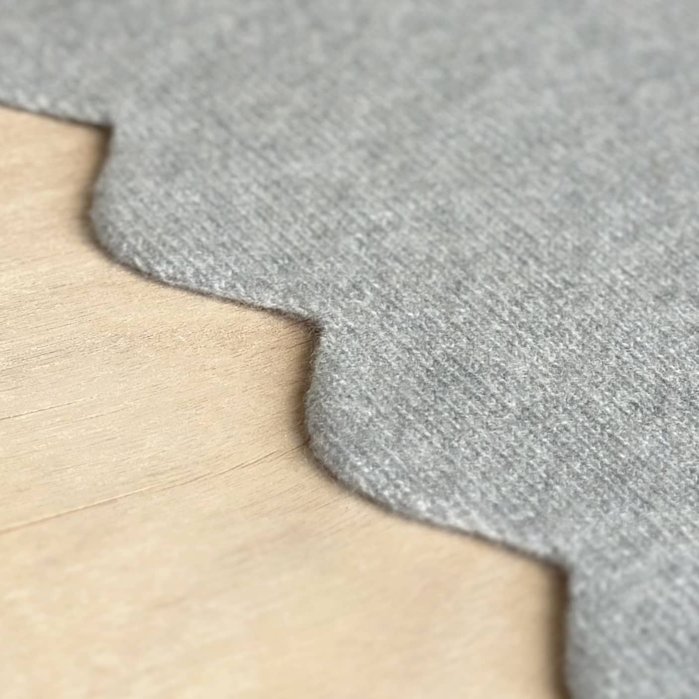 Close up detail of knitted scallop edge baby blanket in pure cashmere. Handmade pure cashmere baby blanket gift with personalisation.