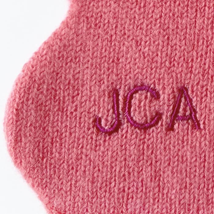 Close up of personalisation on cashmere scarf.