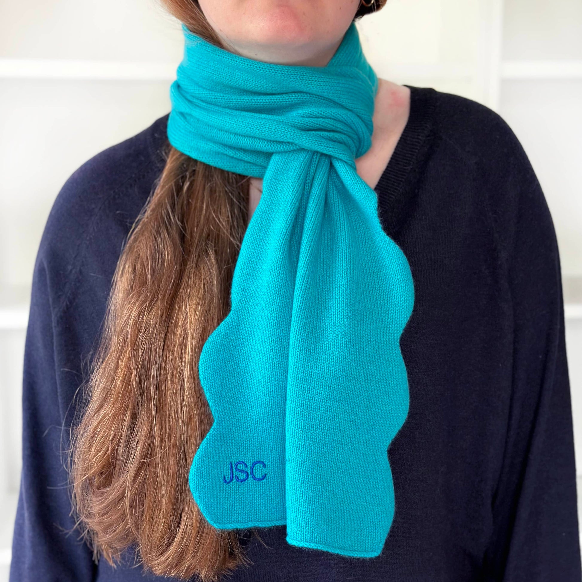 Pure cashmere scarf in turquoise colour with wavy scallop edge and personalisation by Cashmere Party.