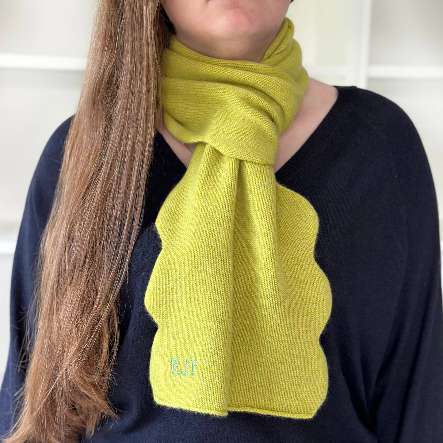 Luxury cashmere handmade scarf on women.  Scallop edge cashmere scarf with personalisation in Lime colour cashmere.