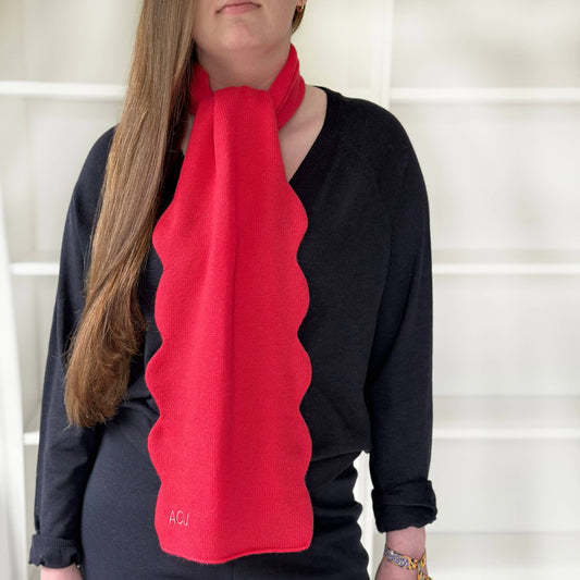 Red pure cashmere scallop edge scarf with personalisation.  Modern bright cashmere with wavy edge details with monogram in red.