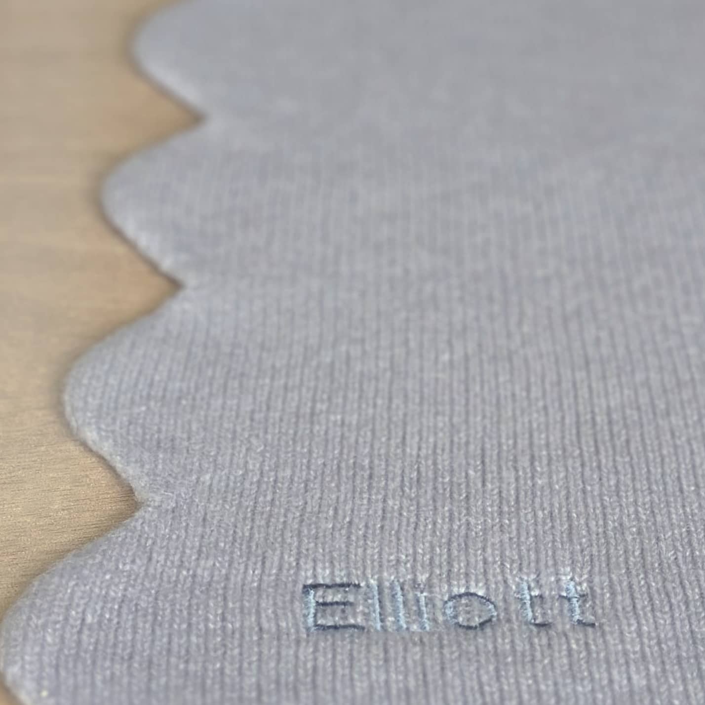 Close up of scalloped edge baby blanket with embroidered personalisation new baby gift by Cashmere Party